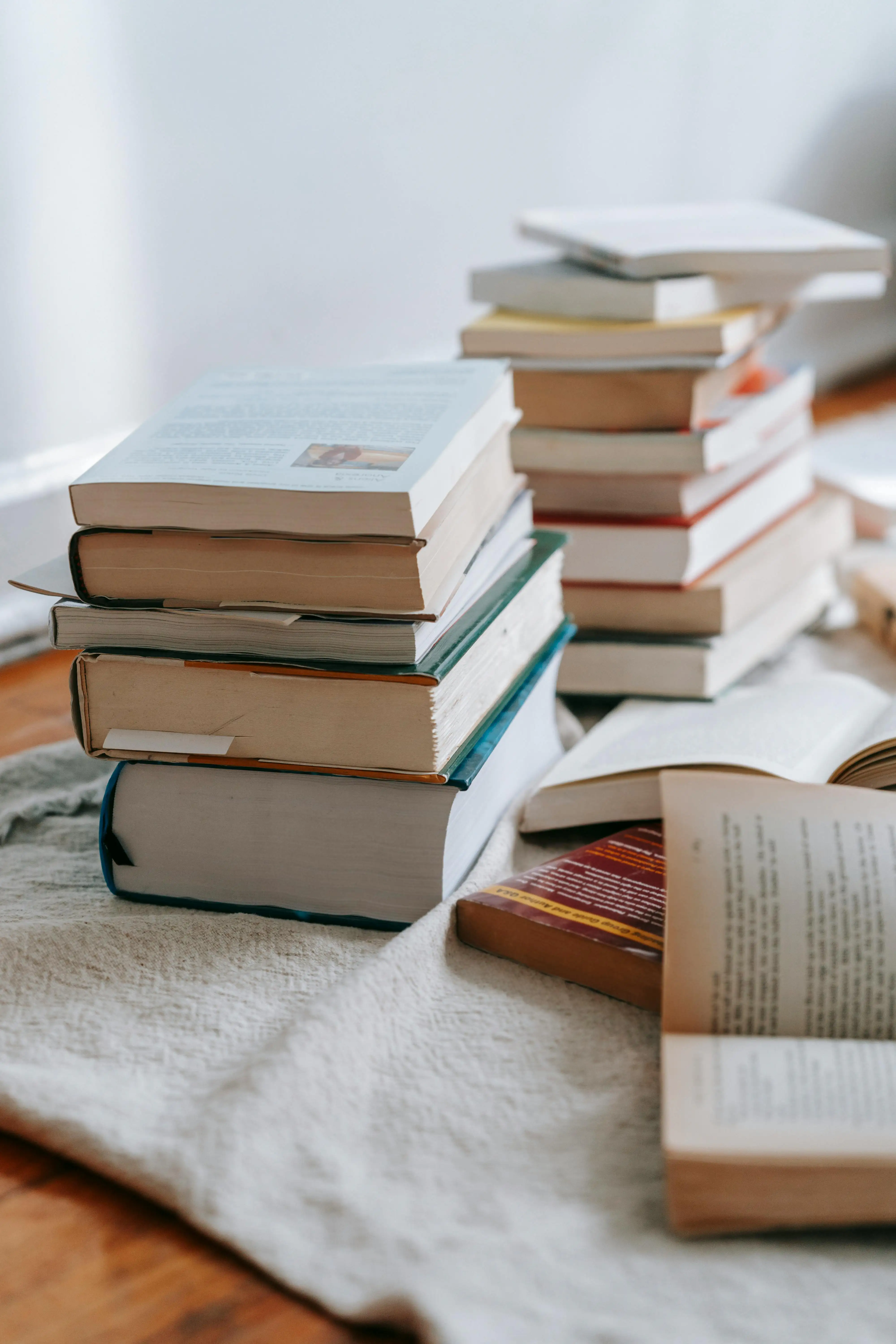 A stack of books on systems thinking and strategic planning